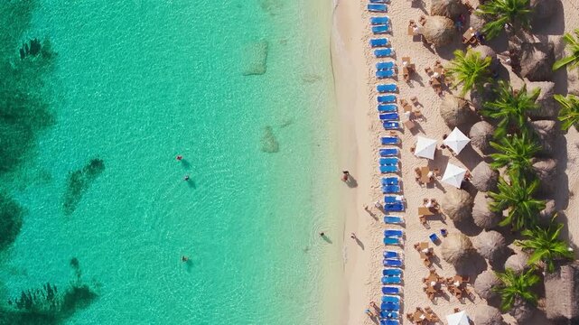 Aerial shots showcase the stunning turquoise waters and sandy beaches of Cozumel, allowing you to relax and enjoy the vibrant tropical atmosphere of this beautiful Mexican destination