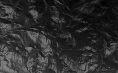 Dark abstract crumpled texture in grayscale, resembling wrinkled foil or metallic fabric, with strong contrasts and depth.