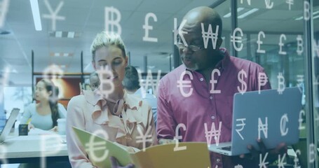woman flipping yellow folder, senior man rotating laptop with floating currency symbols in finance - Powered by Adobe