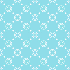 Seamless pattern of white circles and dots on a light blue background, suitable for fabrics, wallpapers, and backgrounds