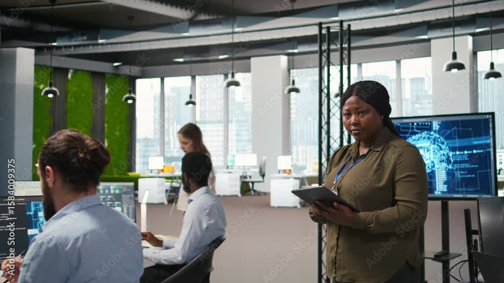 Poster happy female engineer in office automating repetitive tasks using ai scripts. jolly african american