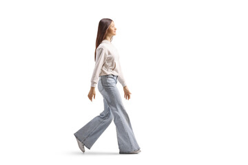 Full length profile shot of a female teenager walking