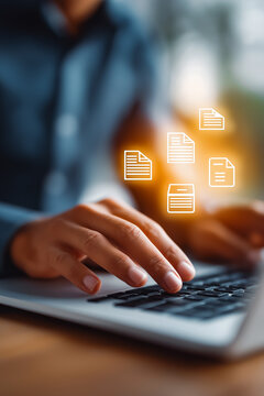 Businessman using laptop with digital invoice icons, representing e-invoicing, billing automation, financial technology, online payment, accounting software, ERP system, and paperless finance process.