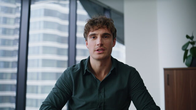 Manager greeting video meeting in office pov shot closeup. Man online call