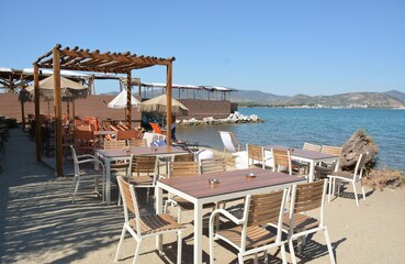Empty cozy cafe on the seashore in the morning