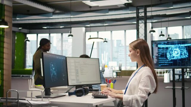 Female engineer using AI LLM chatbot, optimizing company systems performance. System administrator uses artificial intelligence assistant to convert manual workflows into automated scripts, camera A