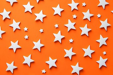 White stars arranged on a vibrant orange background, creating a playful and visually appealing design