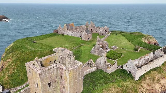 Flight over Dunnottar Castle ruins in Scotland, United Kingdom