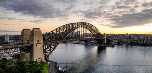 Naklejka premium Aerial panorama of Sydney Bridge at the break of daylight in Sydney, Australia