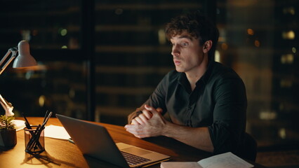 Obraz premium Business coach talking video conference at night office closeup. Man presenting