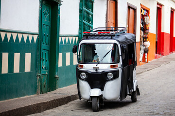 Traditional motor tricycle at the beautiful streets of the colonial town of Concepcion in Antioquia, Colombia.