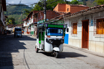 Traditional motor tricycle at the beautiful streets of the colonial town of Concepcion in Antioquia, Colombia.