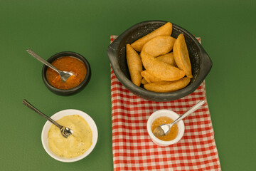 Delicious traditional Colombian empanadas with spicy sauce