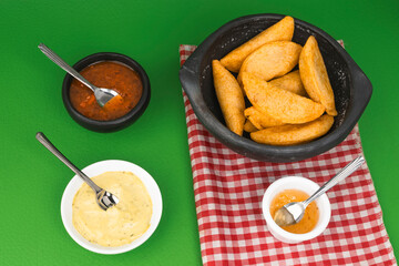 Colombian empanada with spicy sauce 