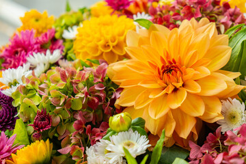 Autumn Fall Bouquet for Thanksgiving holiday. Seasonal Warm colorful blossom flowers arrangement festive decoration. Selective focus 