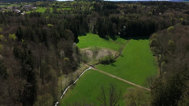 A green hilltop meadow in Grafing, Bavaria, Germany, with the Mariensaeule monument standing proudly. Perfect for peaceful hiking, panoramic views, and relaxing in unspoiled nature.