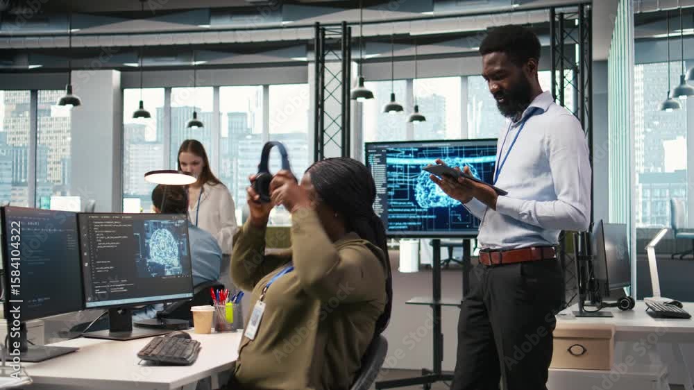 Poster technician next to office coworkers developing software applications, integrating artificial intelli