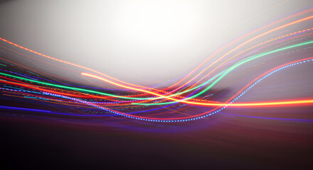 Abstract colorful light trails with wavy lines and streaks on a gradient background, representing data flow, energy, or technological connections.