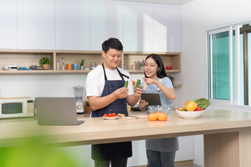 Healthy Cooking Together: Couple Preparing Fresh Vegetables in Modern Kitchen