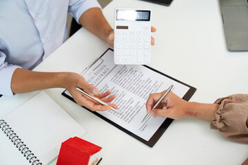 Real Estate Agent Discussing Financial Details with Client