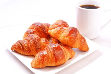 Cup of coffee and croissants
