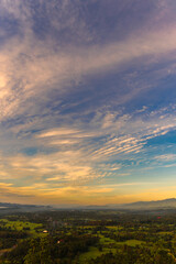 Vertical Horizon Sunset mountain range beautiful landscape mist foggy sunrise beam. Golden sky Mountain landscape mountain. Vertical Amazing Landscape cloud sky on sunrise. Gold sunlight heaven scene