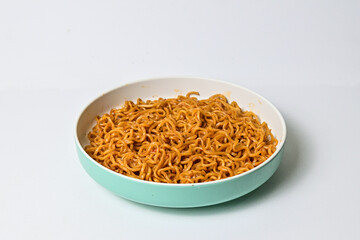 Close up view of fried instant noodle on the plate. isolated on white background. clipping path.