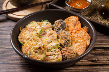 Assorted Korean Pancakes (Modeum Jeon) – Traditional Korean Dish Featuring a Variety of Pan-Fried Items Like Kimchi Jeon, Meat, Seafood, and Vegetables, Served as a Festive or Holiday Food
