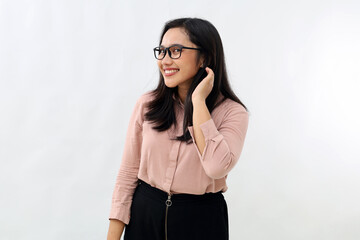 Beautiful and confident young Asian woman, tidying hair behind ear, smiling listening to good news,...