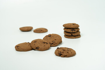 Pile of Delicious Chocolate Cookies with Chocolate Chips on White Background
