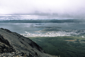 High altitude perspective capturing the contrast of rocky peaks and lush valleys near Ushuaia
