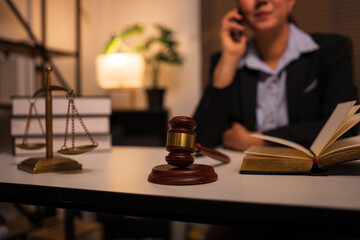 Lawyers sit reading legal books.	
