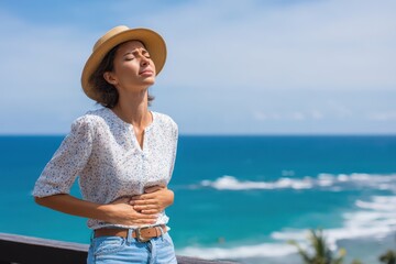 Woman experiences a stomachache from gastritis while traveling related to summer and health