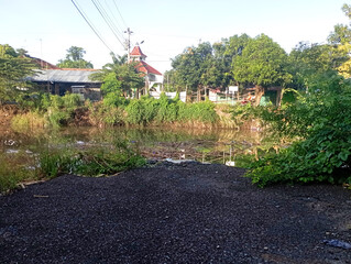photo of the view from across the damaged bridge in the village