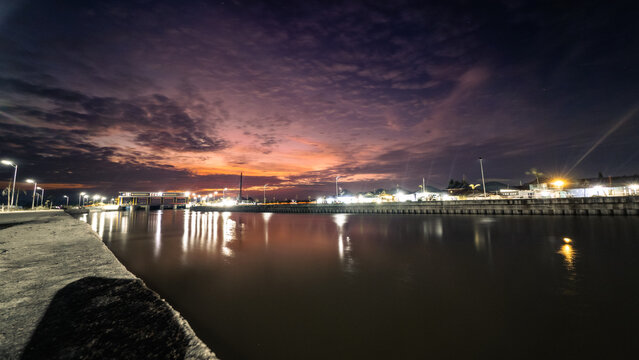 City Waterfront View at Night with Reflections