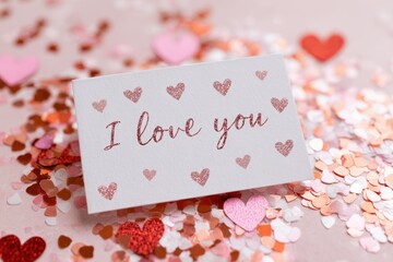 Valentine s Day gift card design with I love you between hearts and confetti also suitable for Mother s Day
