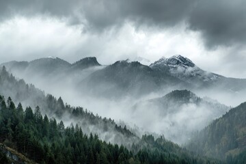 Obraz premium Peaks shrouded in mist and clouds