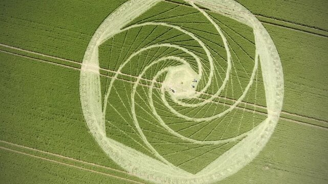 Aerial view intricate crop circle spiral hexagon design wheat field summer pattern nature mystery enigma art agriculture