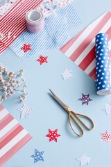 DIY craft table with patriotic paper and tools