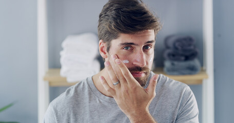 Portrait, cream and beauty with man in bathroom for skincare, morning routine and cosmetics. Self...