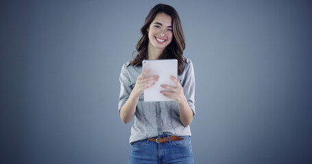 Intern, tablet and smile with portrait of woman in studio for social media, branding and...