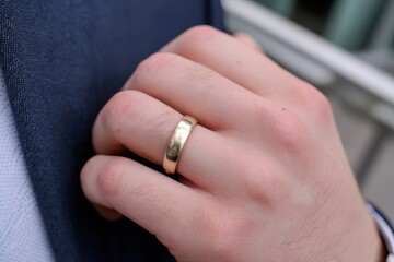 young man wearing a wedding band