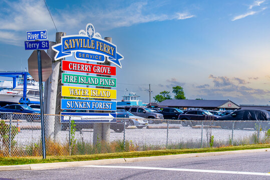 Sayville, New York State, United States of America, 6 June 2024. Sayville Ferry Service in New York. Signboard and parking.