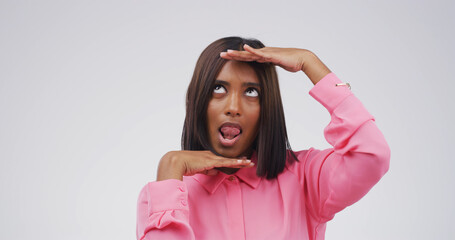 Hand frame, silly and woman in studio for funny face, humor and comedy on white background. Looking...