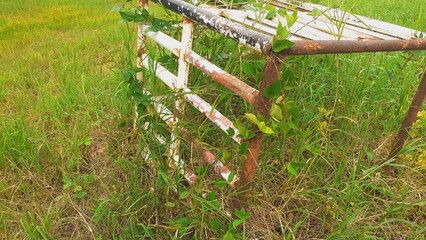 The steel structure was left to rust in the grass.