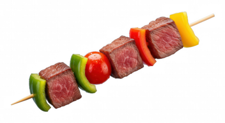Close-up of raw beef kebab skewer with colorful bell peppers and tomato