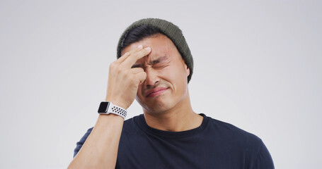 Sick, headache and man in studio with stress, brain fog and vertigo on white background with space....