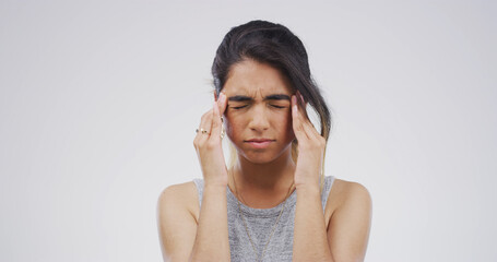 Pain, pressure and girl with headache in studio from stress, hypertension or overwhelmed by strain....