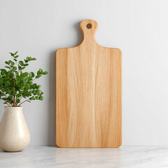 Wooden Cutting Board with Green Plant and Marble Surface 1
