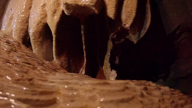 Close-up of dripping stalactites in a cave
